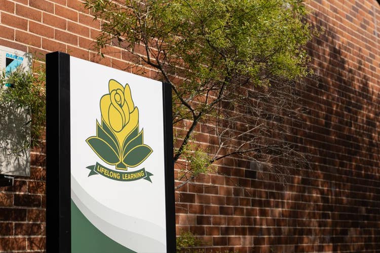 Picture of the school sign and logo.