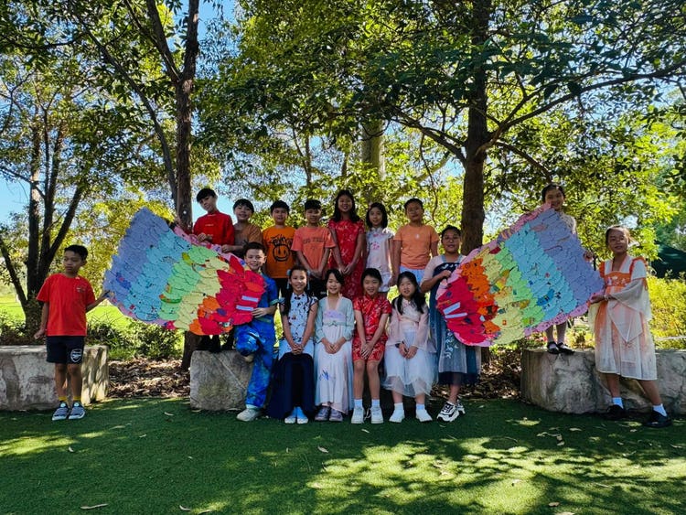 Class of students dressed in Harmony Day cultural dress
