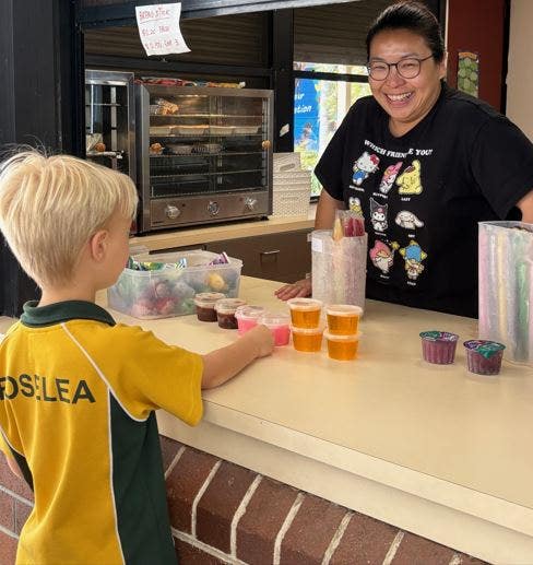 Student being served at the canteen